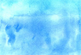 Abstract watercolor hand-drawn blue brush strokes. Brightly colored background.