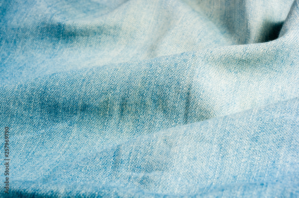 Blue washed faded jeans texture with seams Blue washed faded jeans texture with seams