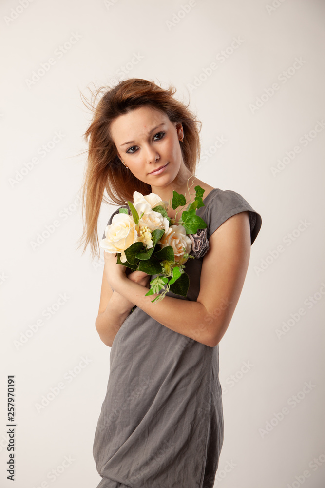 Beautiful blond girl posing for photo in studio Beautiful blond girl posing for photo in studio