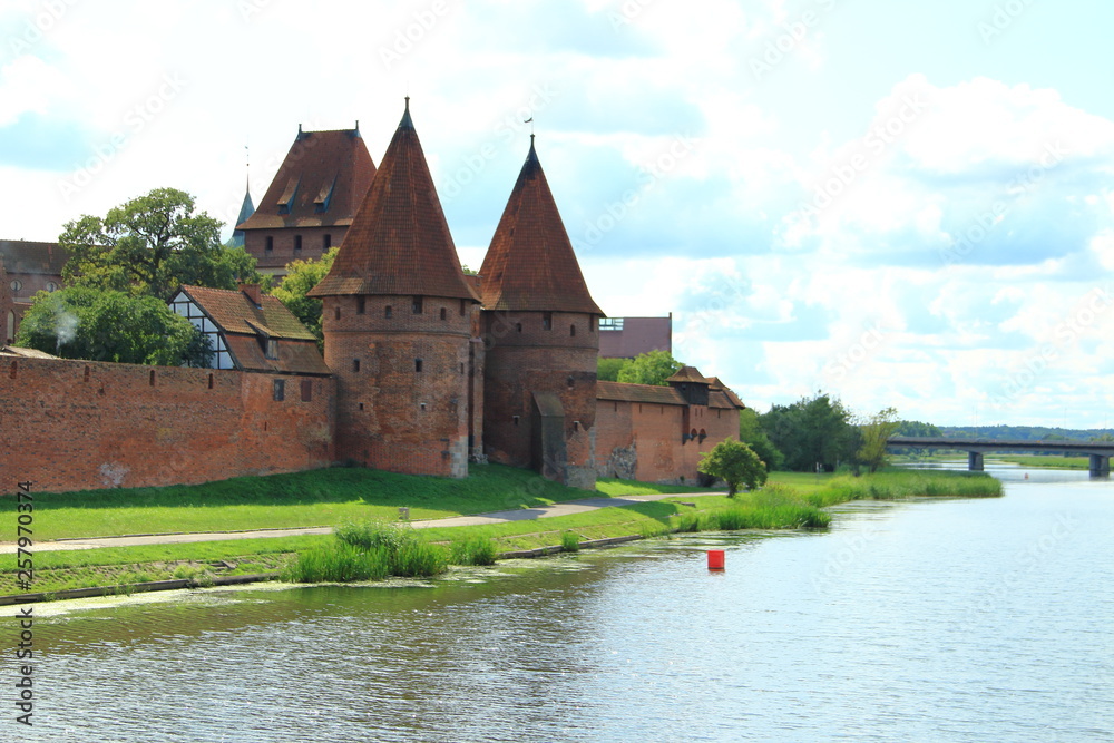 Malbork Castle across the river Nogat