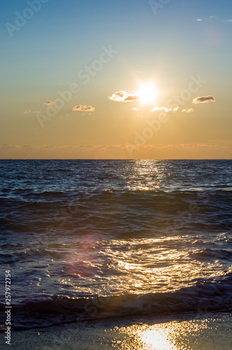 Amazing sea sunset  the sun  waves  clouds