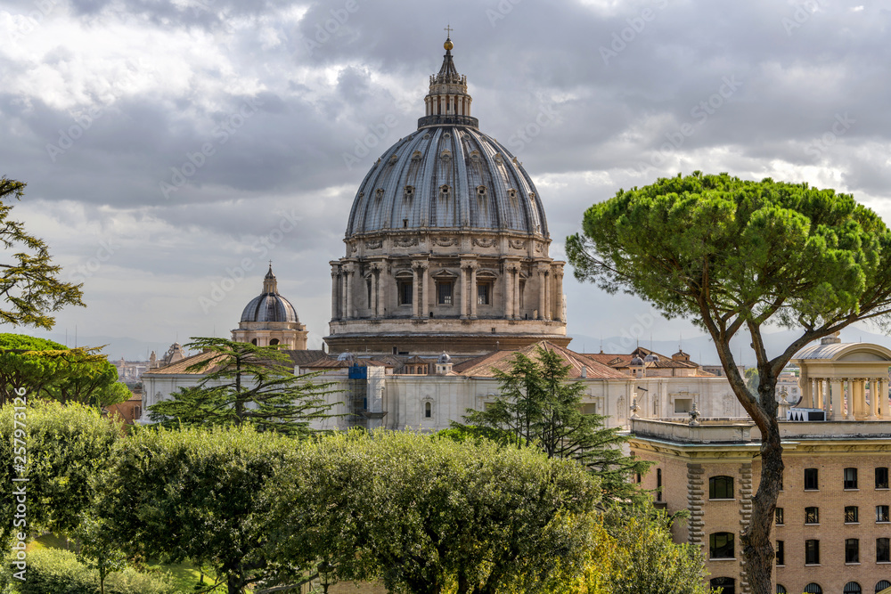 St. Peter's Basilica - A cloudy morning view of St. Peter's Basilica, as seen from Vatican Gardens, in Vatican City, Rome, Italy.
