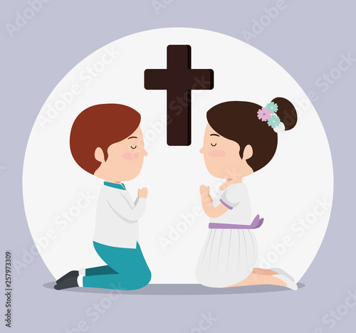 girl and boy with cross to first communion