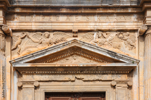 Triangular pediment and frieze with relief sculpture on the Palace of Charles V, famous renaissance building inside the Alhambra of Granada, Spain