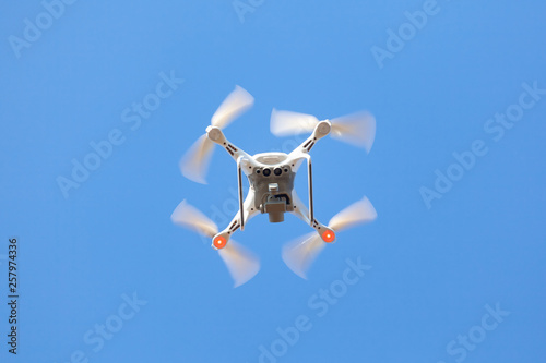 Flying drone with blue sky background  technology