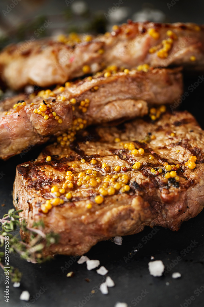 Grilled beef steaks with spices.