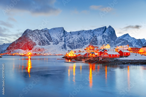 Moskenes island on Lofoten islands archipelago  in Norway over polar circle, Scandinavia, Europe - Lovely dusk scene of Villages Reine and Hamnoy: Reine fjord and snow-capped mountains in background.  © Feel good studio
