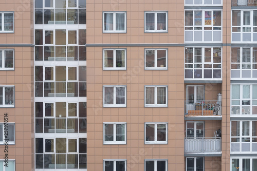 multi-storey office building with worker working overtime. lighting and working people within.