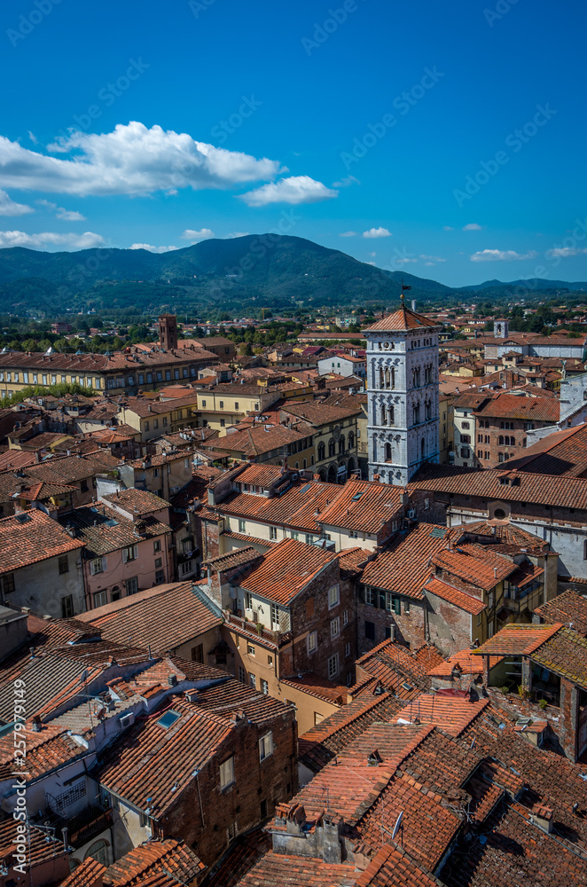 View on old city with Basilica of San Michele from Torre delle Ore clock tower in Lucca. Italy
