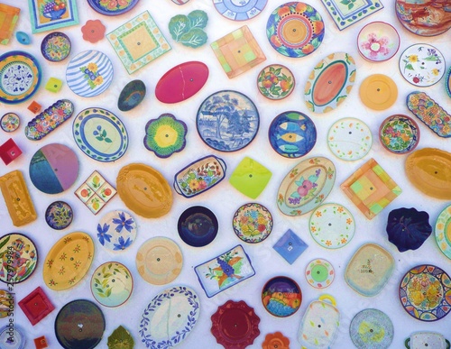 Colorful ceramic plates secured to a Portuguese shop wall