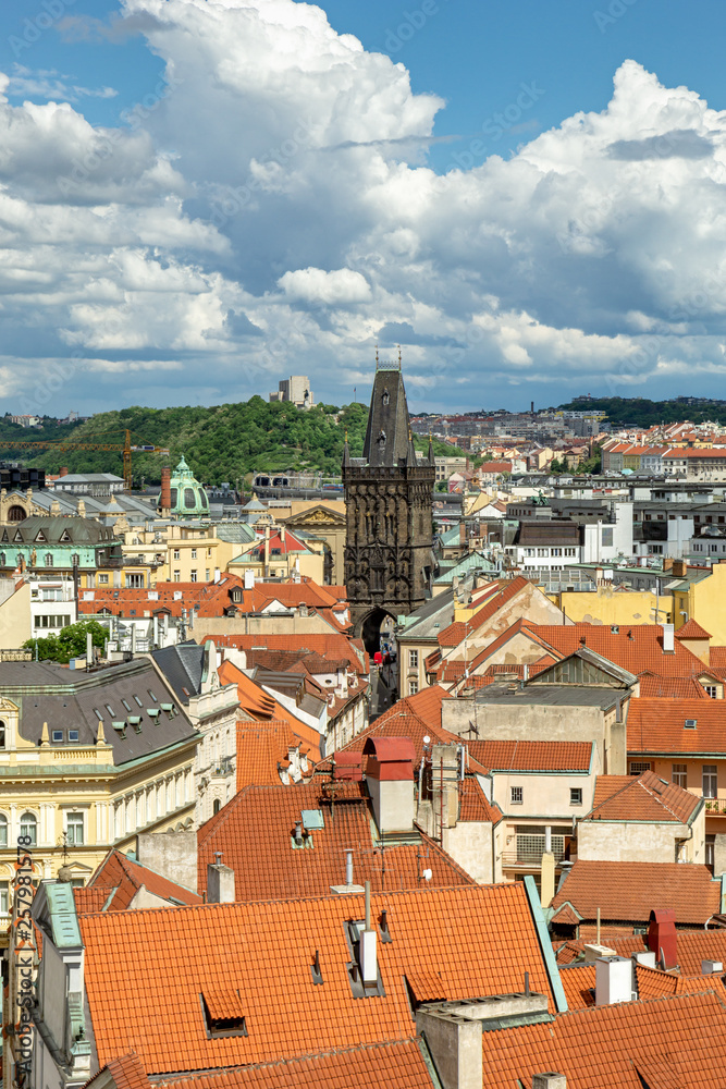 The Prague Powder Tower rises on the roofs of houses