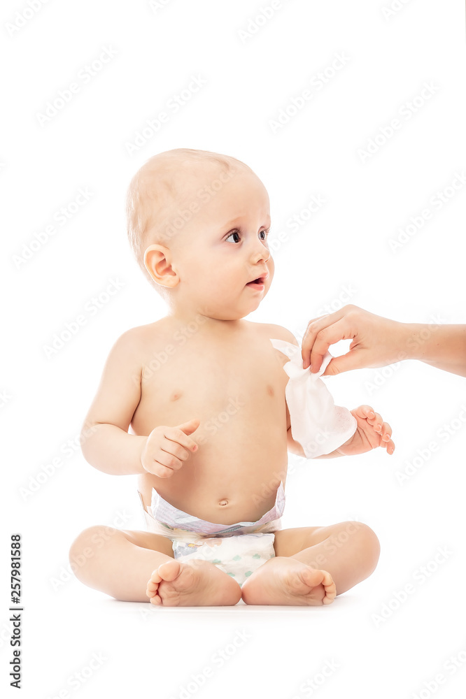 mom wiping baby's bottom with baby wipe isolated on a white background. concept cleaning wipe, pure, clean mom wiping baby's bottom with baby wipe isolated on a white background. concept cleaning wipe, pure, clean