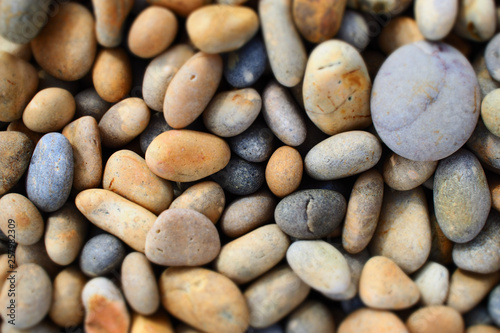 Rounded pebbles on beach