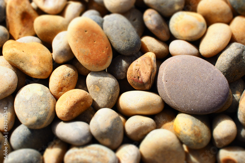 Rounded pebbles on beach