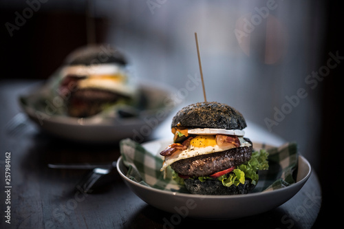 Black hamburgers with egg and bacon