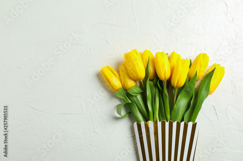 Bouquet of beautiful tulips in gift box, space for text