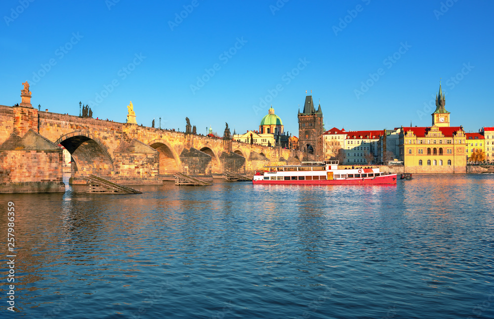 Obraz premium Scenic view Charles bridge and historical center of Prague, buildings and landmarks of old town at sunset, Prague, Czech Republic