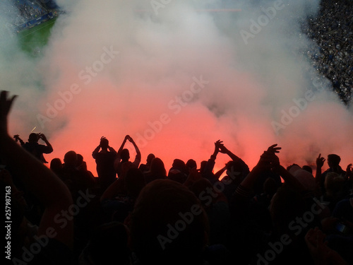 Football fans lit up the lights and smoke flares. revolution. protest photo