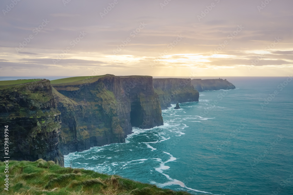 Cliffs of Moher in Wild Atlantic Way with beautiful sunset and turquoise water Cliffs of Moher in Wild Atlantic Way with beautiful sunset and turquoise water