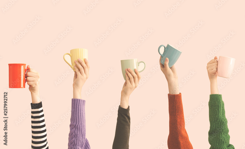 Many different arms raised up holding coffee cup - obrazy, fototapety, plakaty 