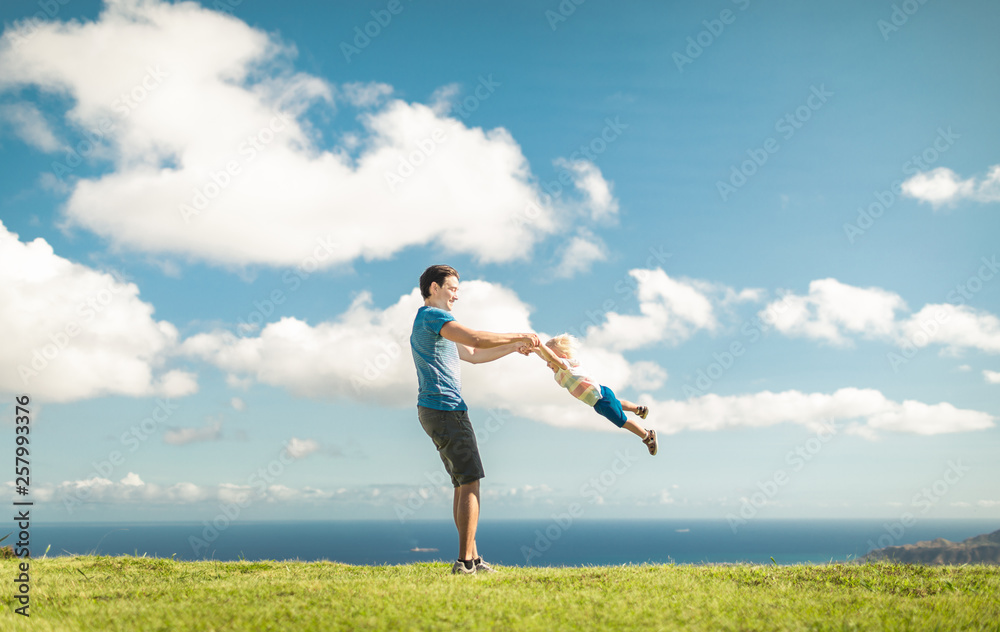 Father son having fun playing in the park Father son having fun playing in the park