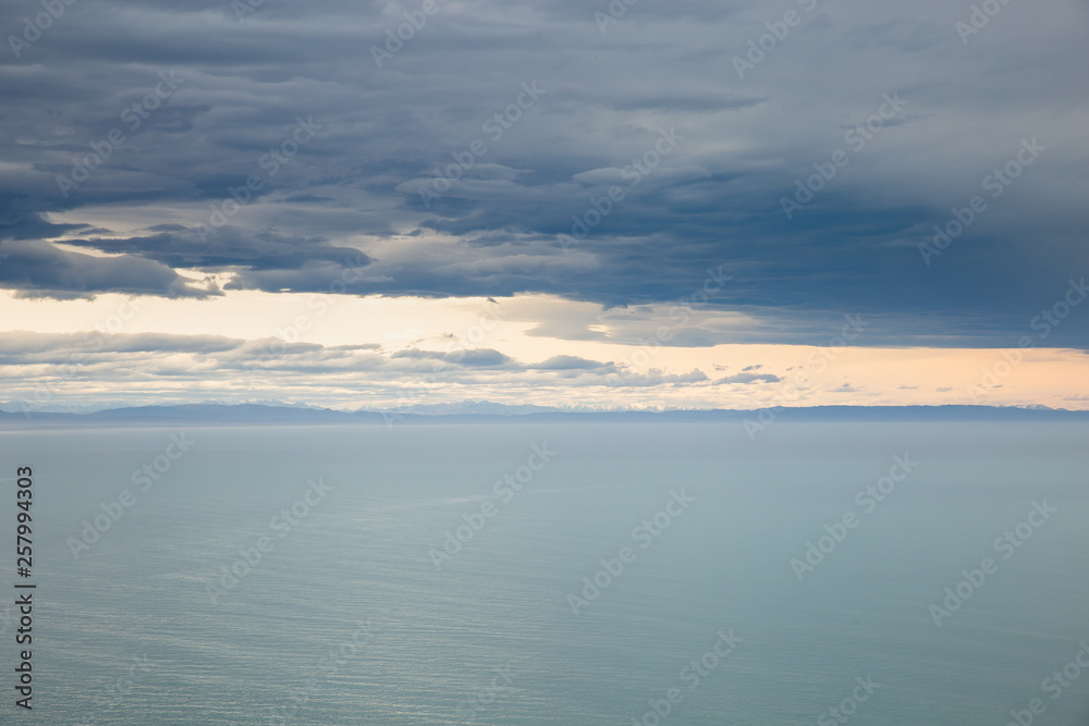 sea ocean and dark blue sky clouds