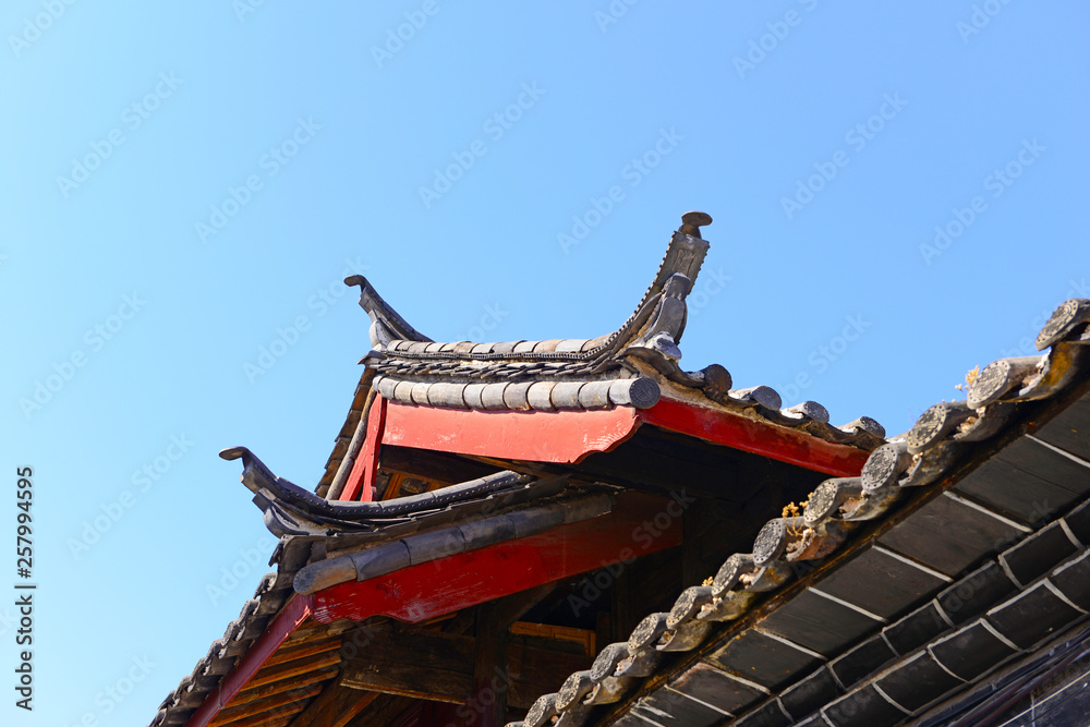 The corner of the ancient building against the blue sky The corner of the ancient building against the blue sky