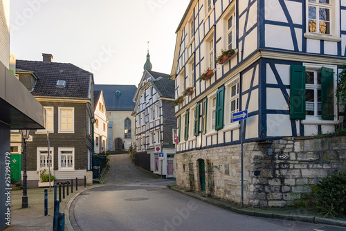 Fototapeta Naklejka Na Ścianę i Meble -  Outdoor sunny view of empty  street in small town Neviges, in Velbert City with old unique exterior facade of traditional wooden German architecture. 