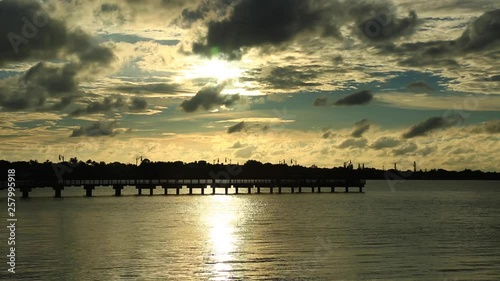 Wide, sunset over pier in Jenson Beach photo