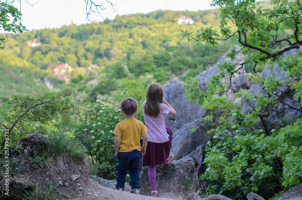 Two kids observe Buda hills around