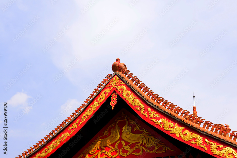 The corner of the ancient building against the blue sky The corner of the ancient building against the blue sky