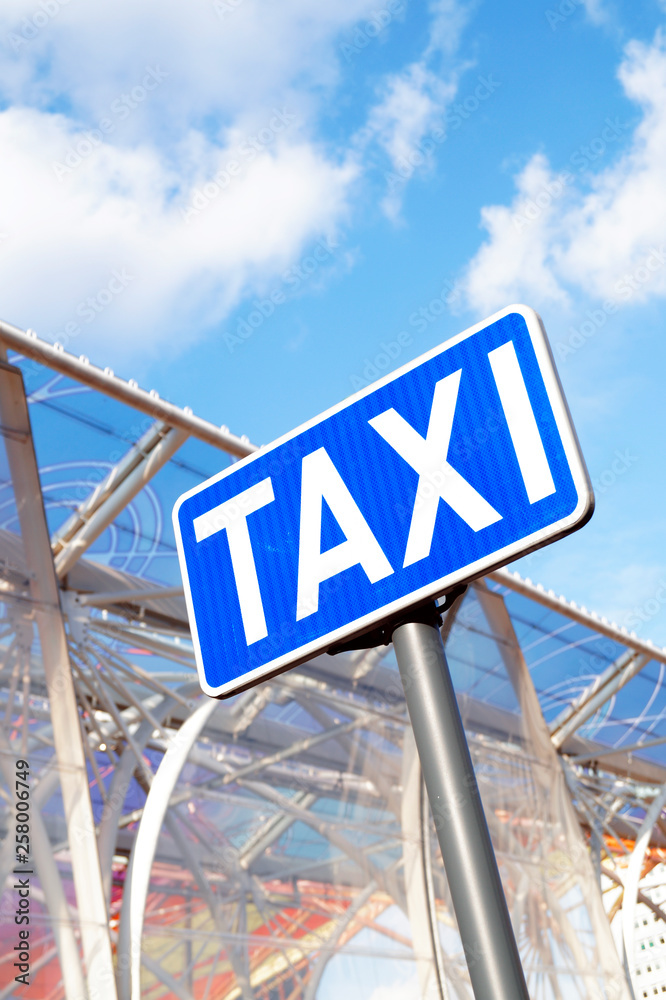 Fototapeta premium Taxi sign with blue sky and clouds 2