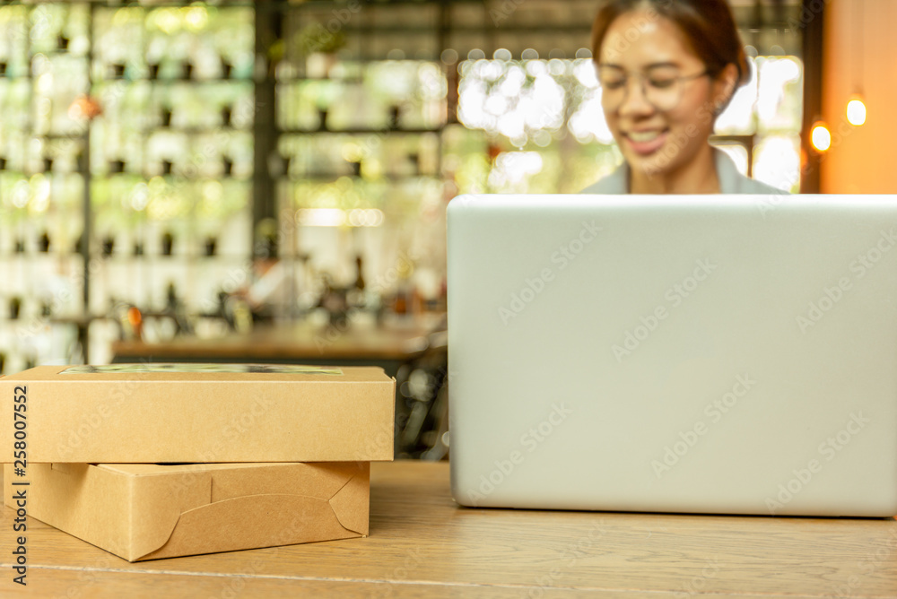Startup business man working on computer laptop with parcel on table. Startup business man working on computer laptop with parcel on table.