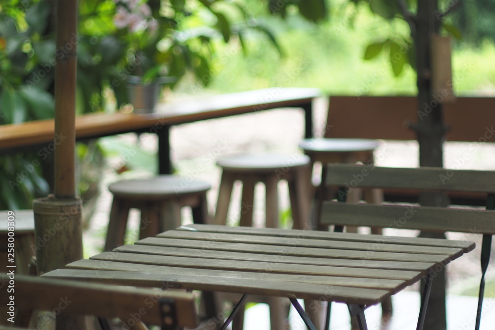 Chairs and tables made of wood in natural medium Chairs and tables made of wood in natural medium