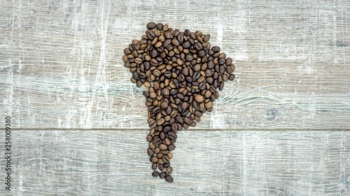 stop motion animation of formation figure of south america continent from fresh roasted coffee beans, the figure of south america pulses like a heart, 4K photo