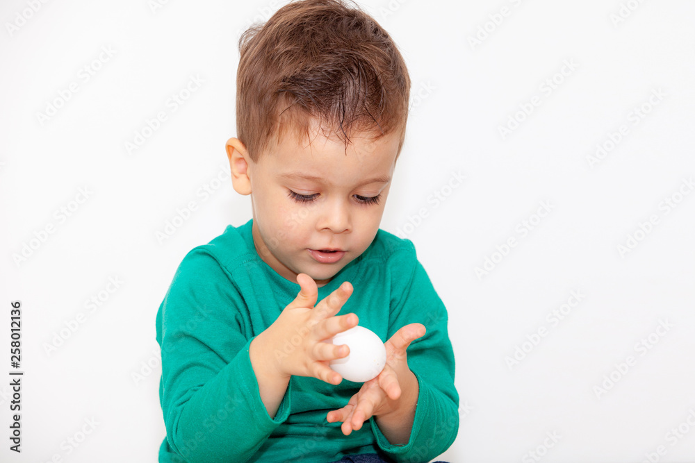 baby with easter egg in hands on white background baby with easter egg in hands on white background