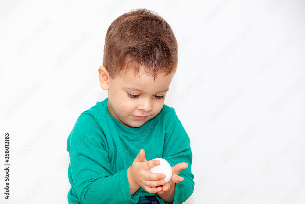 baby with easter egg in hands on white background baby with easter egg in hands on white background