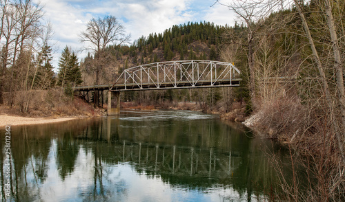 Railroad bridge over the Couer d'Alene river Idaho photo