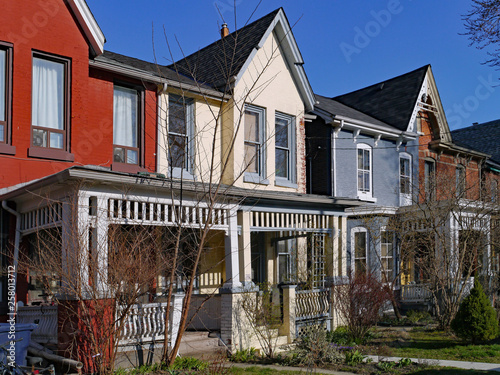 Photography Row of old Victorian style brick houses with gables