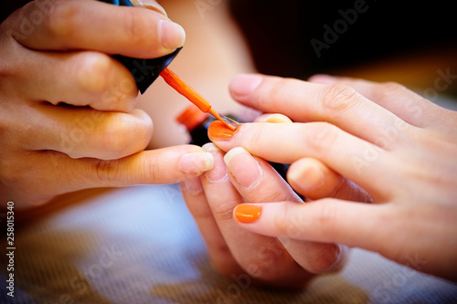 Doing nails at salon