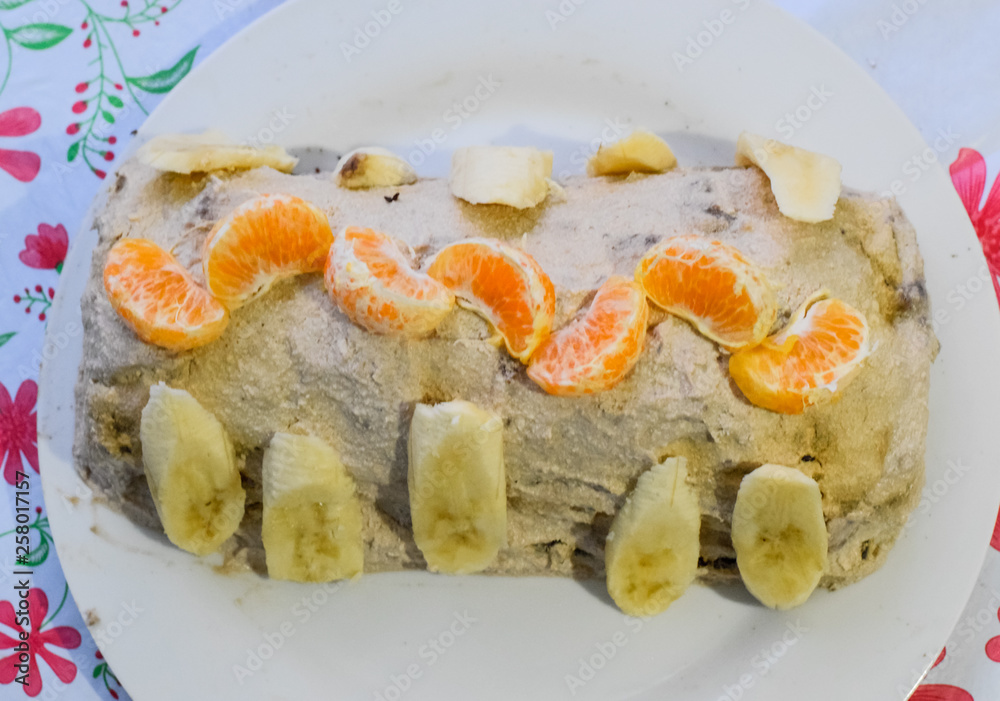 Cake with banana and tangerines, sprinkled with chocolate. Cake with banana and tangerines, sprinkled with chocolate.