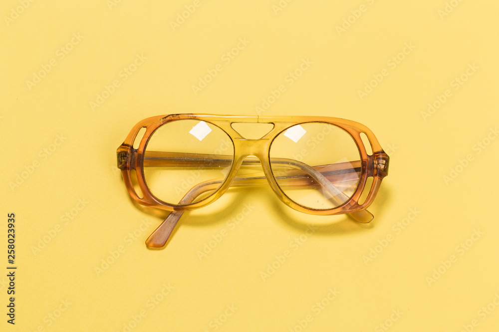 Old glasses on yellow Old glasses on yellow