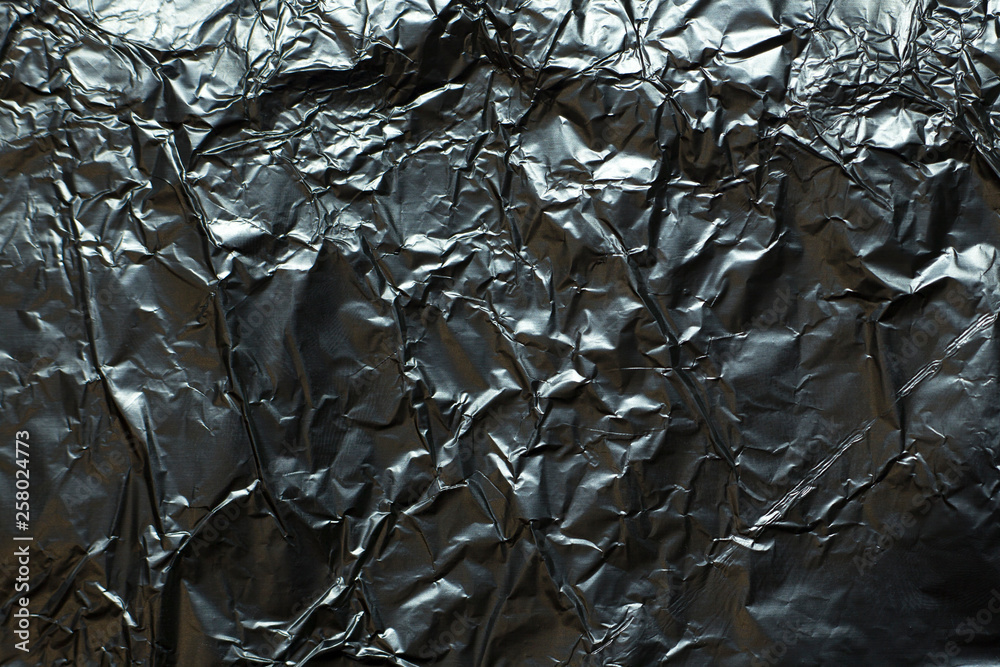rumpled silver foil background rumpled silver foil background