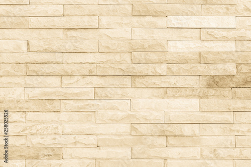 Cream and white brick wall texture background.