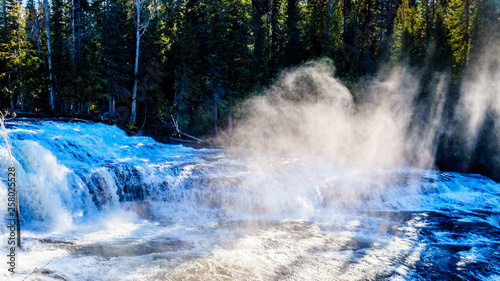 Water of the Murtle River as it tumbles over the cusp of Dawson Falls in Wells Gray Provincial Park in British Columbia, Canada, viewed from the north side of the river