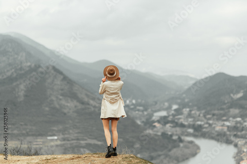 Beautiful girl in nature traveling. Nature and mountains in the capital of Georgia. © pavelvozmischev