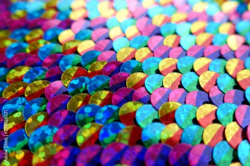 sequins colorful background.Mottled Scales Fabric Background.Sequins holographic macro background.ridescent fabric.Scales background. fabric background. sequined textile
