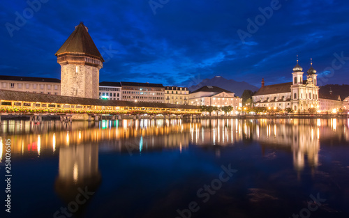 Old wooden architecture called Chapel Bridge in Luzern or Lucerne, Switzerland during sunset and twilight © 1989STUDIO