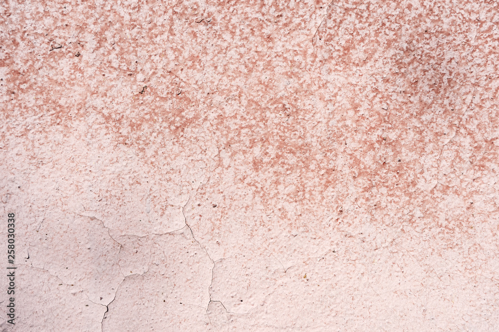 Old wall covered with cracked paint closeup as background and texture Old wall covered with cracked paint closeup as background and texture