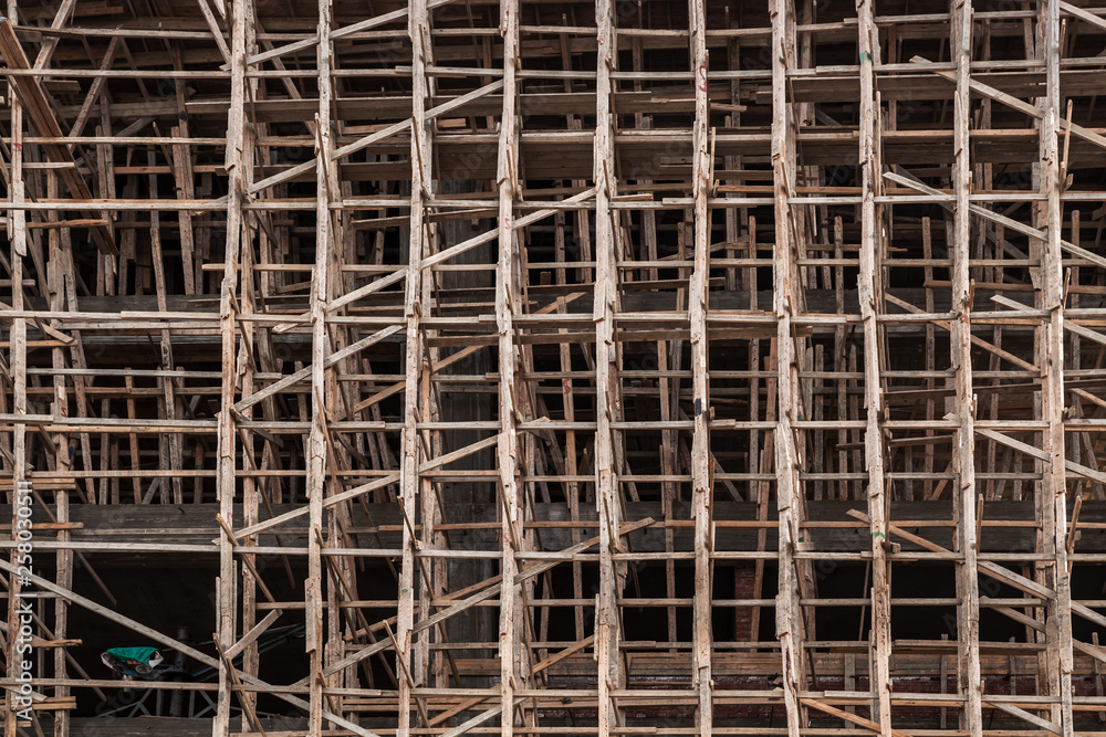 Facade covered with wooden scaffolding